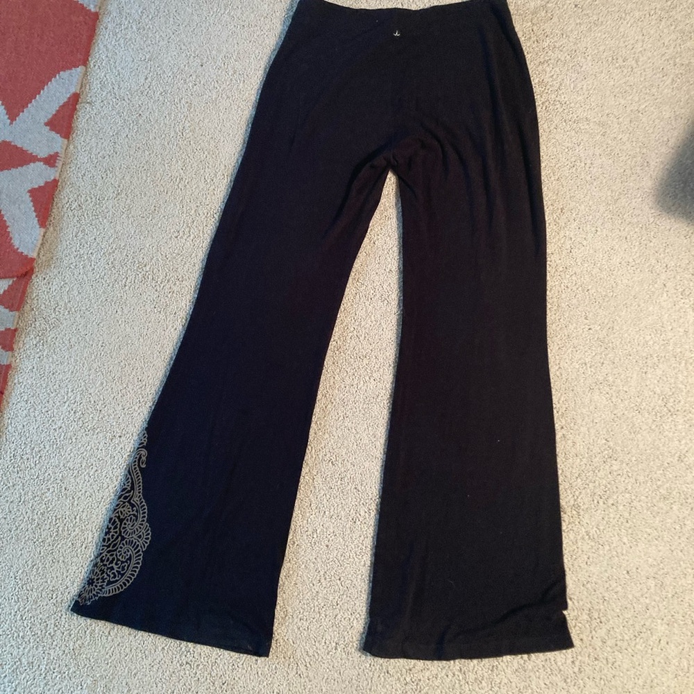 Prana black yoga pants with tattoo detailing on one leg - Picture 2 of 7